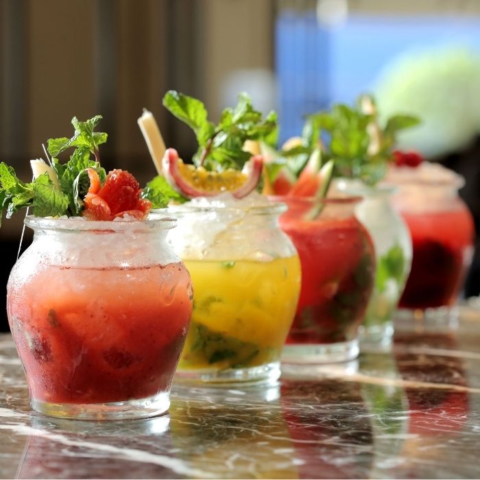 row of different colored caribbean mojitos
